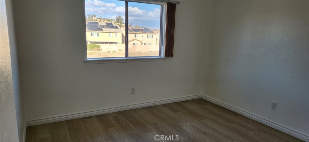 713 Walnut Drive Lake Elsinore, CA 92530 - Photo 18 of 28 an empty room with a window