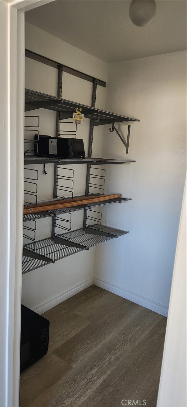 713 Walnut Drive Lake Elsinore, CA 92530 - Photo 19 of 28 a view of storage and utility room with racks on the wall