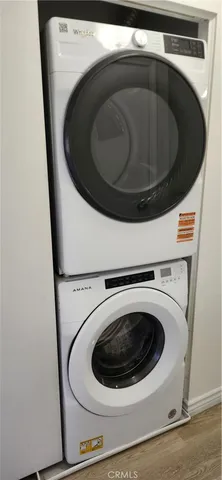 a bathroom with a shower toilet and sink