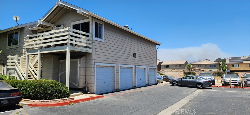 713 Walnut Drive Lake Elsinore, CA 92530 - Photo 24 of 28 a car parked in front of house