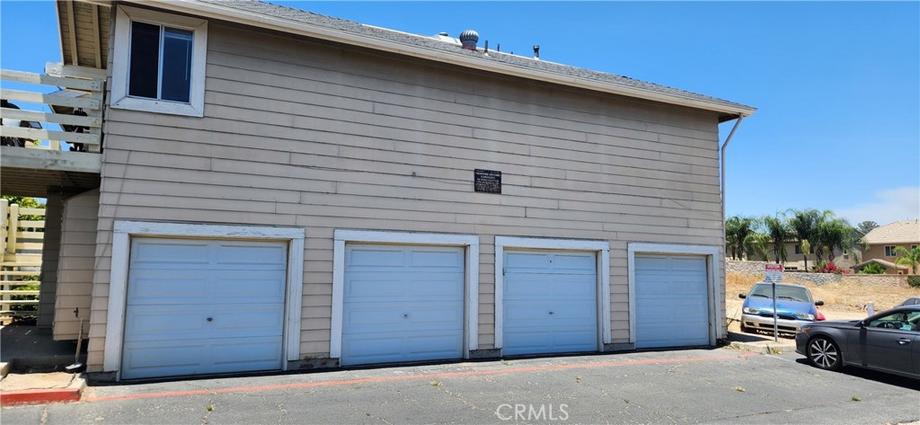 713 Walnut Drive Lake Elsinore, CA 92530 - Photo 25 of 28 a front view of a house with a garage
