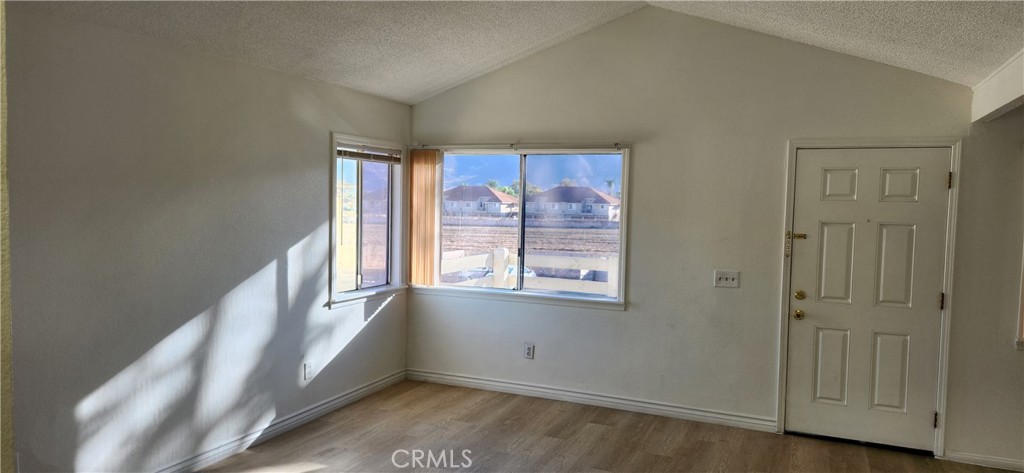 713 Walnut Drive Lake Elsinore, CA 92530 - Photo 10 of 28 an empty room with windows