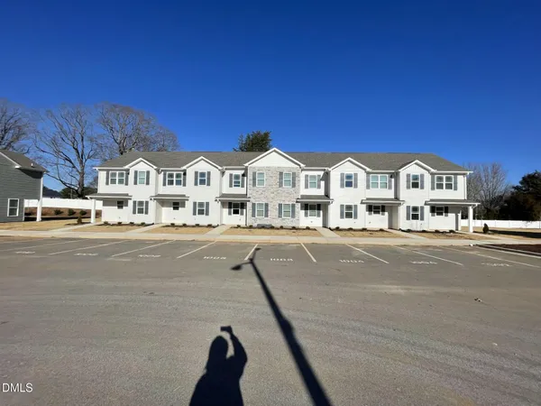 a view of multiple houses with a street