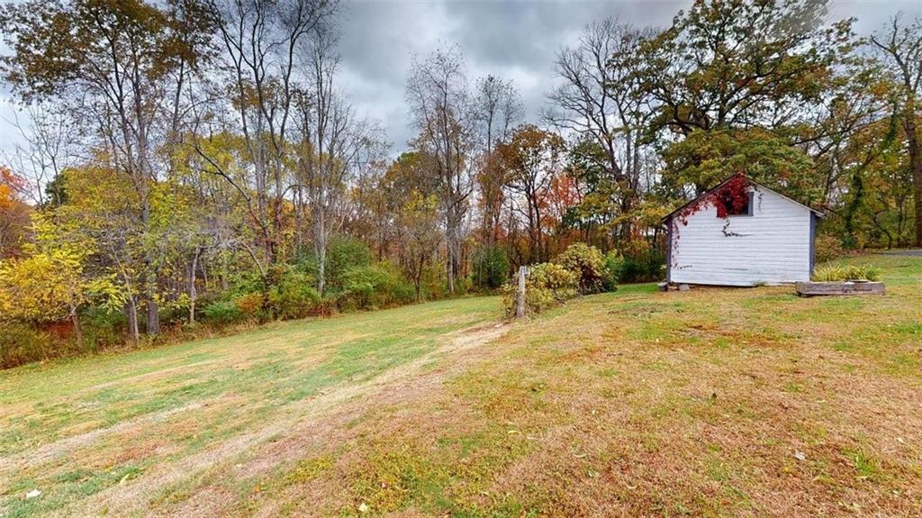 218 Myoma Road Mars, PA 16046 - Photo 11 of 35 a house with trees in front of it