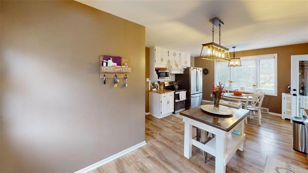 218 Myoma Road Mars, PA 16046 - Photo 18 of 35 a very nice looking room with kitchen island furniture and a wooden floor