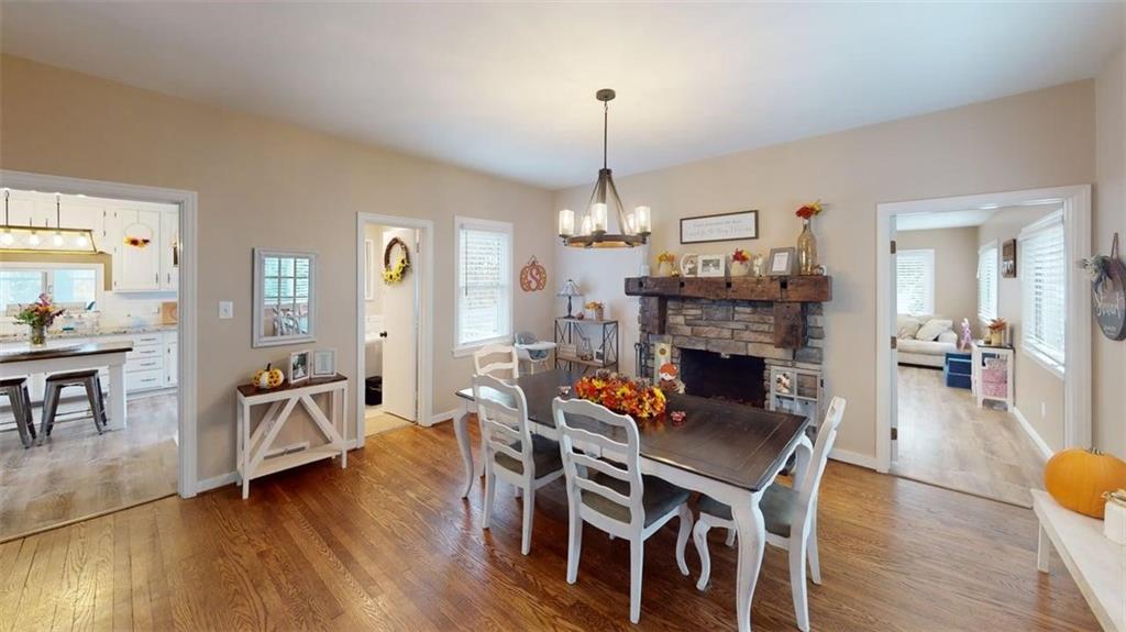 218 Myoma Road Mars, PA 16046 - Photo 20 of 35 a view of a dining room and livingroom with furniture wooden floor a chandelier