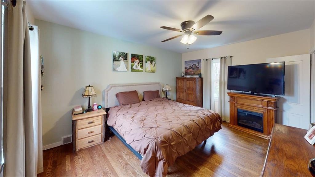 218 Myoma Road Mars, PA 16046 - Photo 30 of 35 a bedroom with a bed and a flat screen tv