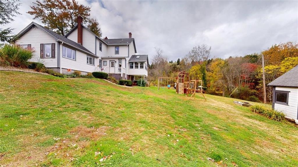218 Myoma Road Mars, PA 16046 - Photo 3 of 35 a view of a house with a swimming pool