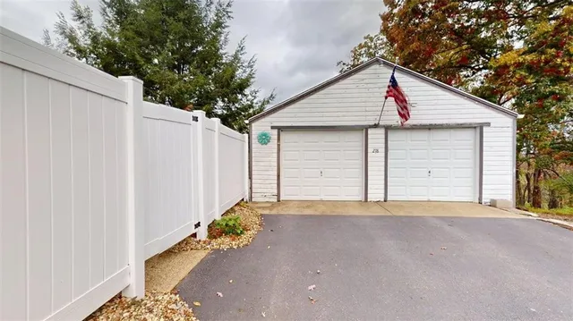 a view of a house with pool and yard