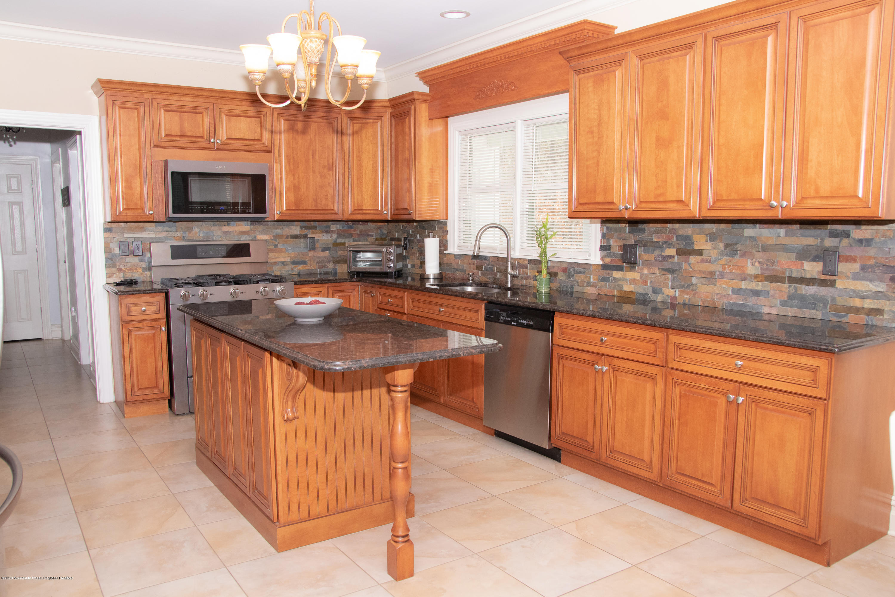 906 Hurley Road Jackson, NJ 08527 - Photo 12 of 47 a kitchen with stainless steel appliances granite countertop a sink stove and cabinets