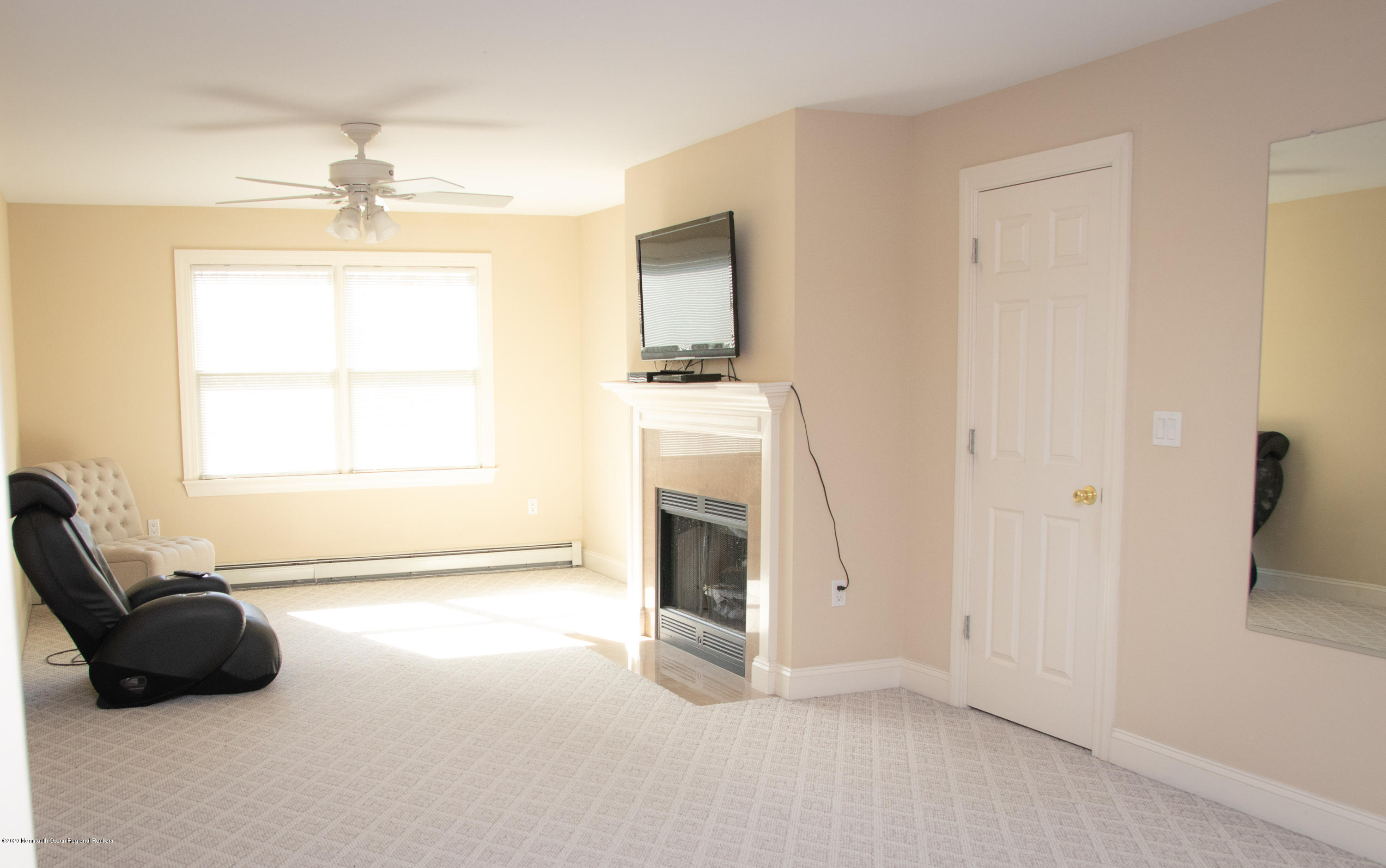 906 Hurley Road Jackson, NJ 08527 - Photo 29 of 47 an empty room with fireplace and windows