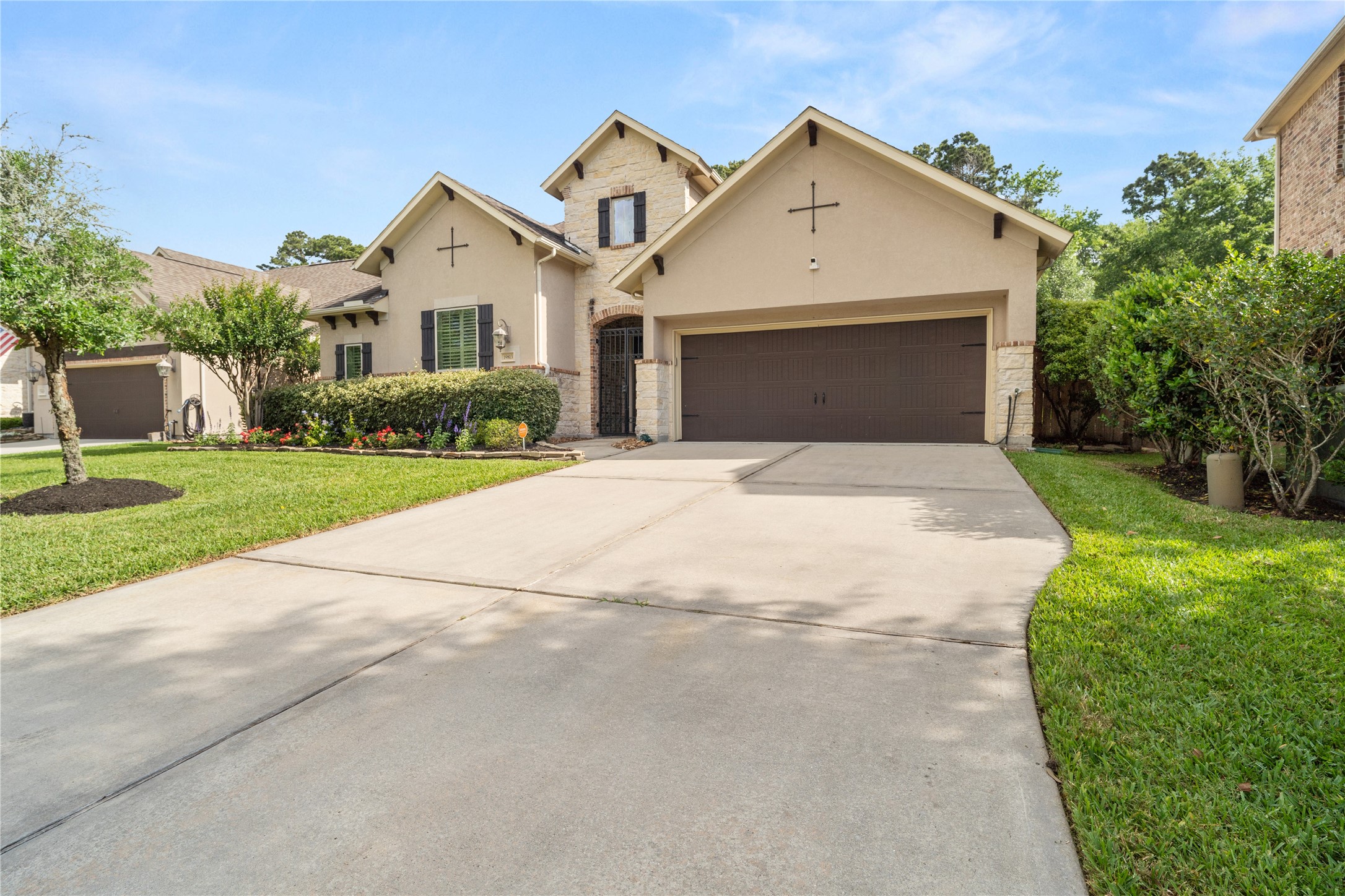 19813 Cullen Ridge Drive Porter, TX 77365 - Photo 4 of 44 Discover the ease of a spacious three-car tandem garage, offering ample parking and convenience.