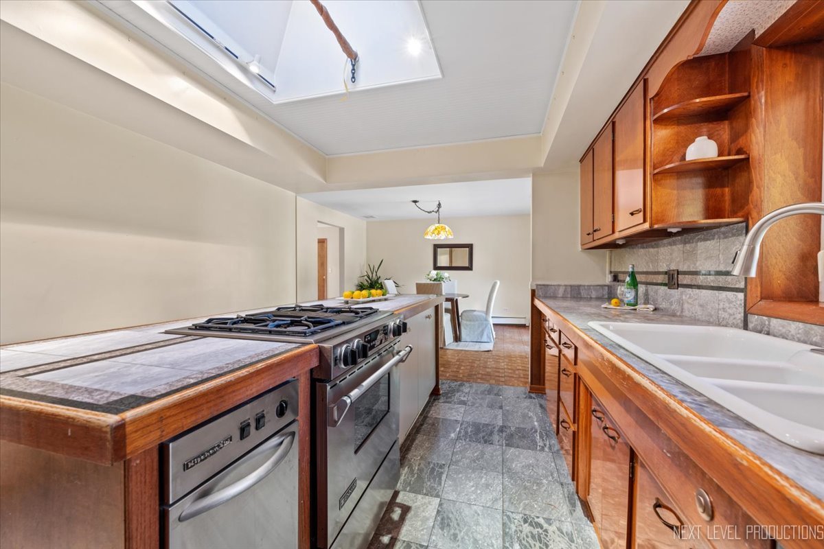 49W794 Lenschow Road Sycamore, IL 60178 - Photo 18 of 40 a kitchen with a stove and a sink