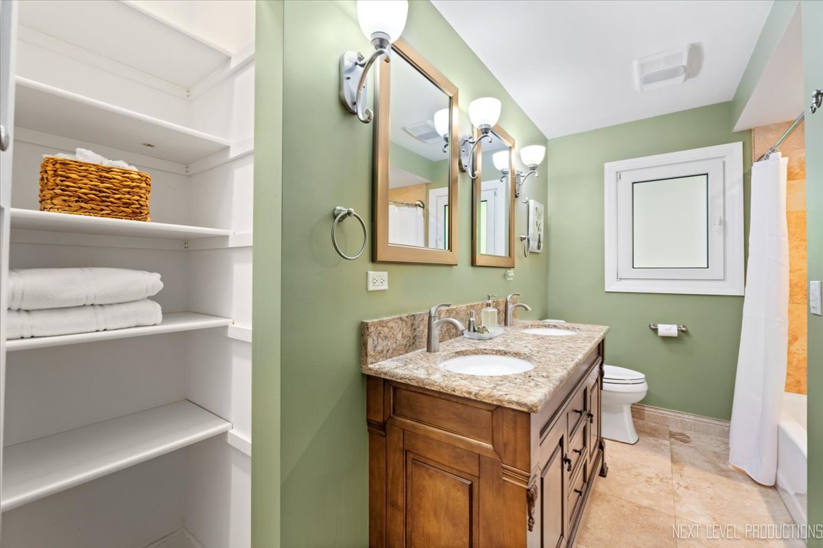 49W794 Lenschow Road Sycamore, IL 60178 - Photo 28 of 40 a bathroom with a sink toilet and a mirror