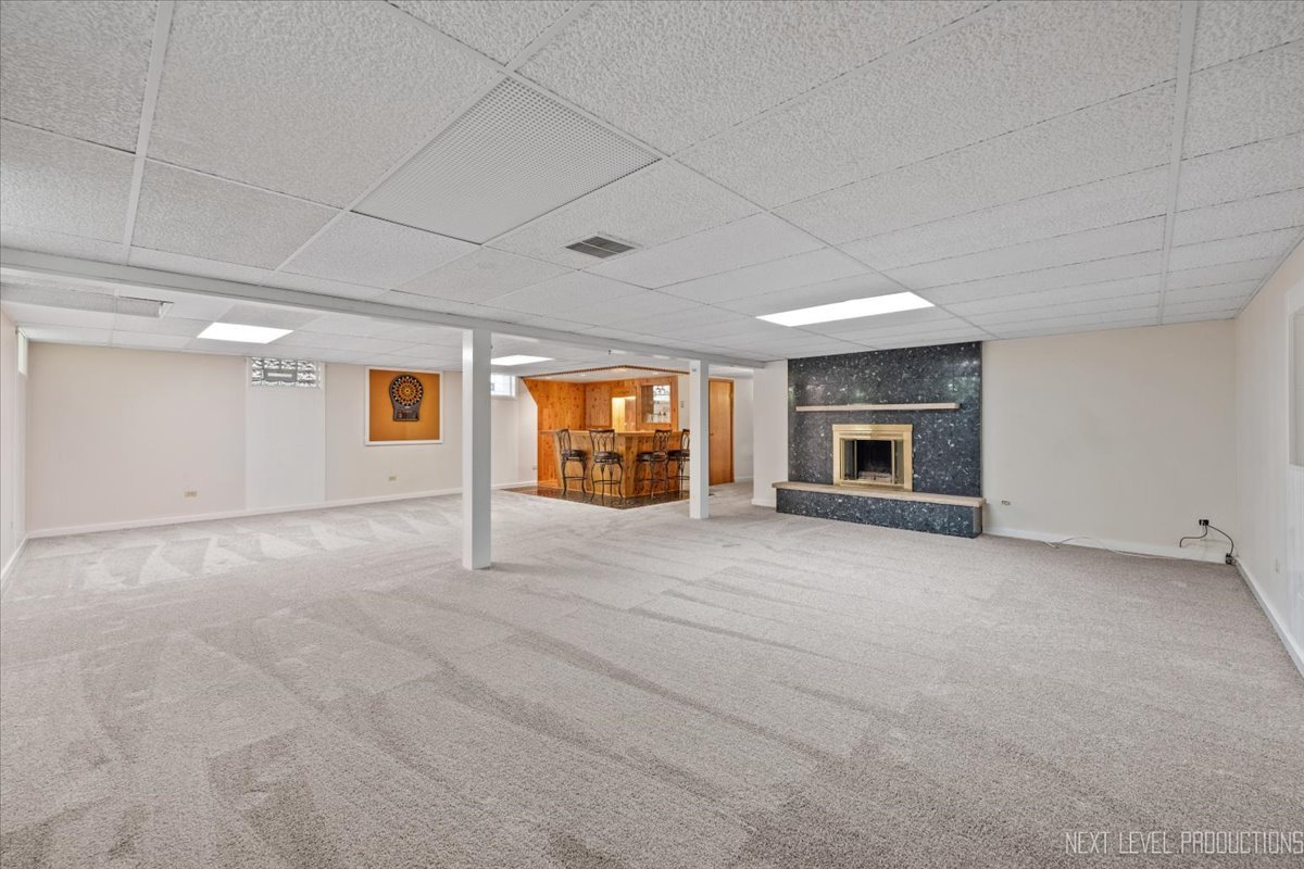 49W794 Lenschow Road Sycamore, IL 60178 - Photo 29 of 40 a view of an empty room with fire place and a window