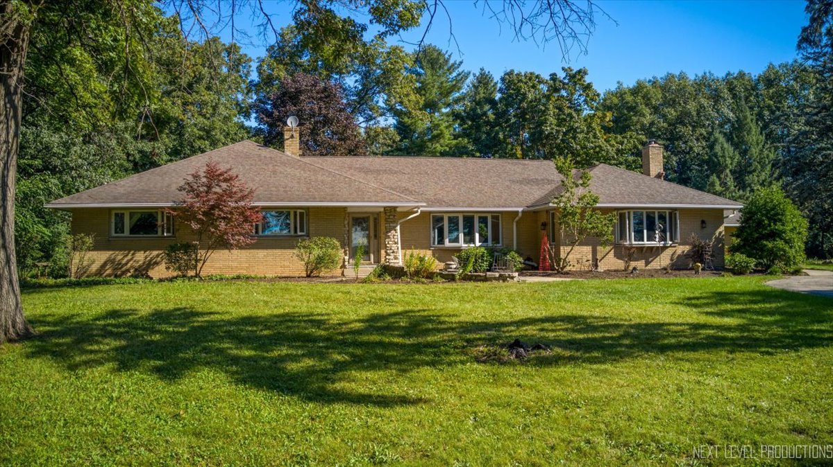 49W794 Lenschow Road Sycamore, IL 60178 - Photo 3 of 40 a front view of a house with a garden