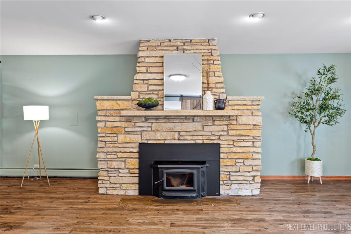 49W794 Lenschow Road Sycamore, IL 60178 - Photo 10 of 40 a living room with furniture and a fireplace