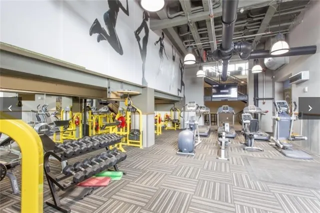 a living room with lots of furniture and a rug