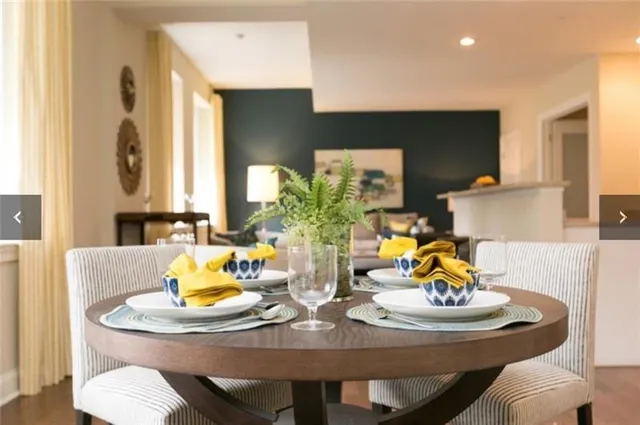 a view of a dining table and chairs in the kitchen