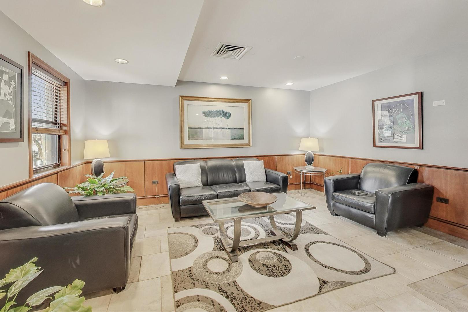 6030 North Sheridan Road, Unit 411 Chicago, IL 60660 - Photo 4 of 20 a living room with furniture potted plant and a window