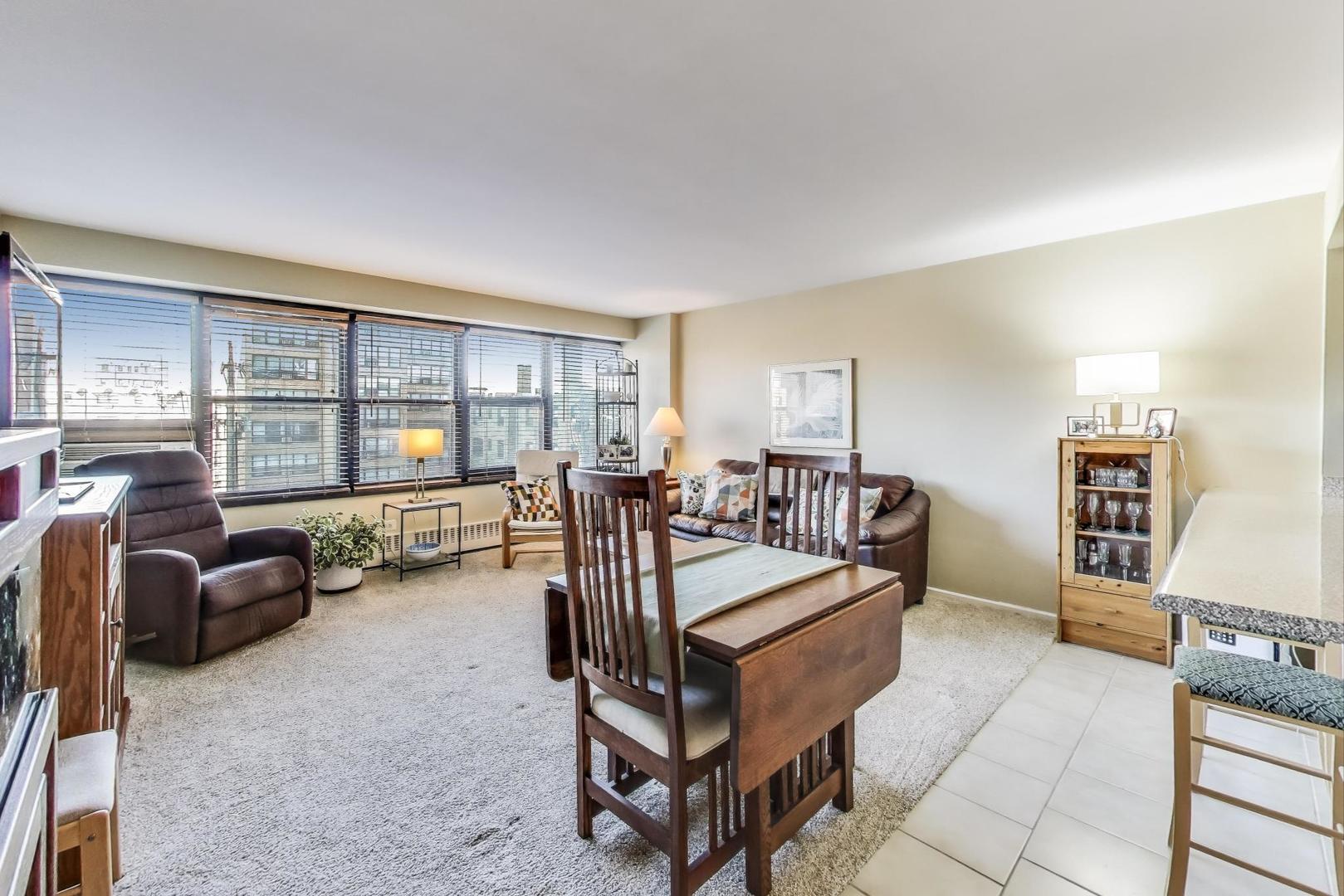 6030 North Sheridan Road, Unit 411 Chicago, IL 60660 - Photo 7 of 20 a living room with furniture and a flat screen tv