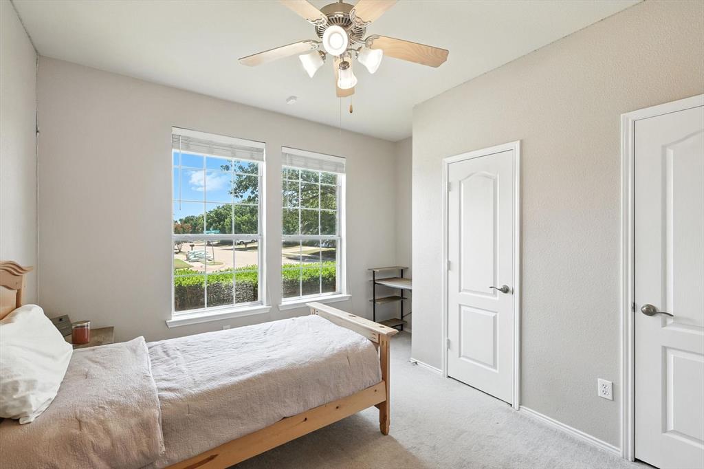 13521 Ponderosa Ranch Road Fort Worth, TX 76262 - Photo 14 of 27 a bedroom with a bed and a window
