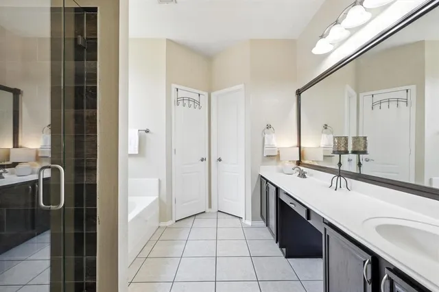 a bathroom with a sink double vanity and a mirror