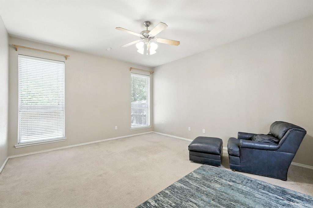 13521 Ponderosa Ranch Road Fort Worth, TX 76262 - Photo 21 of 27 a bedroom with furniture and a window