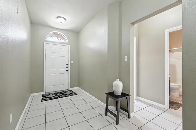 wooden floor with a bathroom
