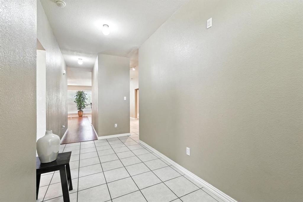 13521 Ponderosa Ranch Road Fort Worth, TX 76262 - Photo 4 of 27 wooden floor with a bathroom