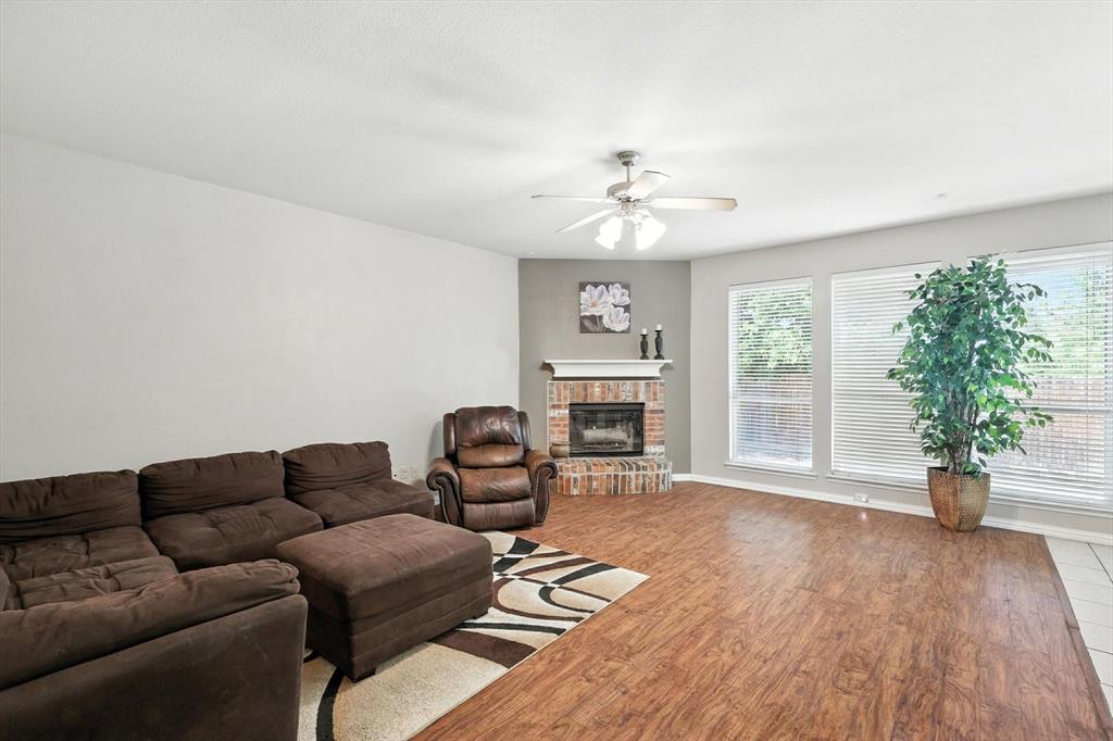 13521 Ponderosa Ranch Road Fort Worth, TX 76262 - Photo 5 of 27 a living room with furniture and a large window