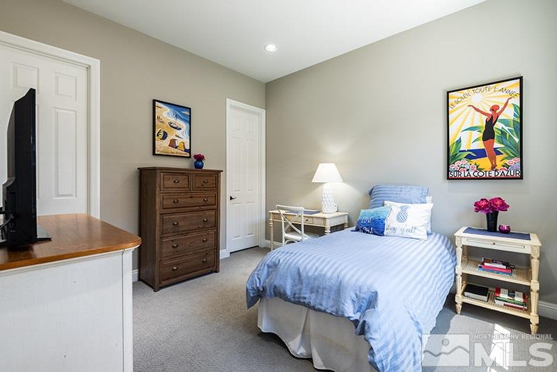 10055 Gold Cup Lane Reno, NV 89521 - Photo 16 of 25 a bedroom with a bed and a flat screen tv