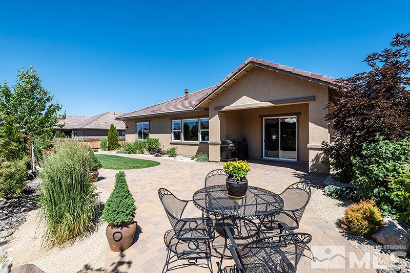 10055 Gold Cup Lane Reno, NV 89521 - Photo 22 of 25 a view of house with backyard and outdoor seating