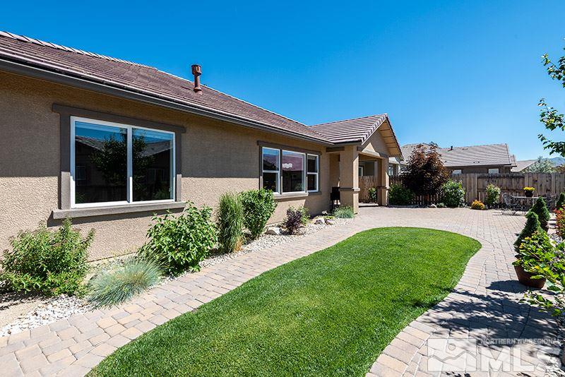 10055 Gold Cup Lane Reno, NV 89521 - Photo 23 of 25 a front view of a house with a yard