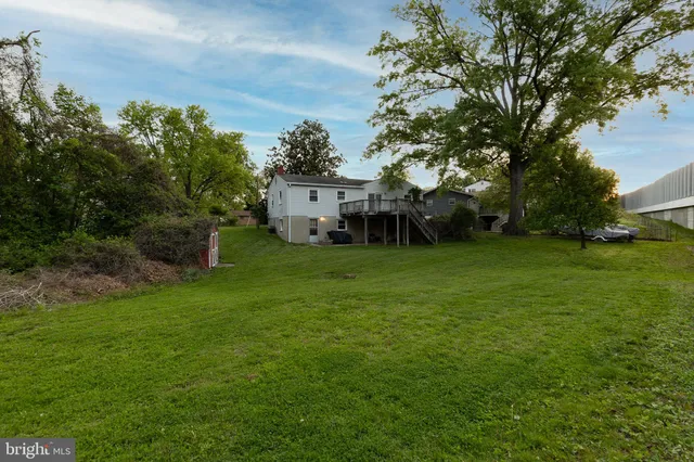 a view of a house with a yard porch and sitting area