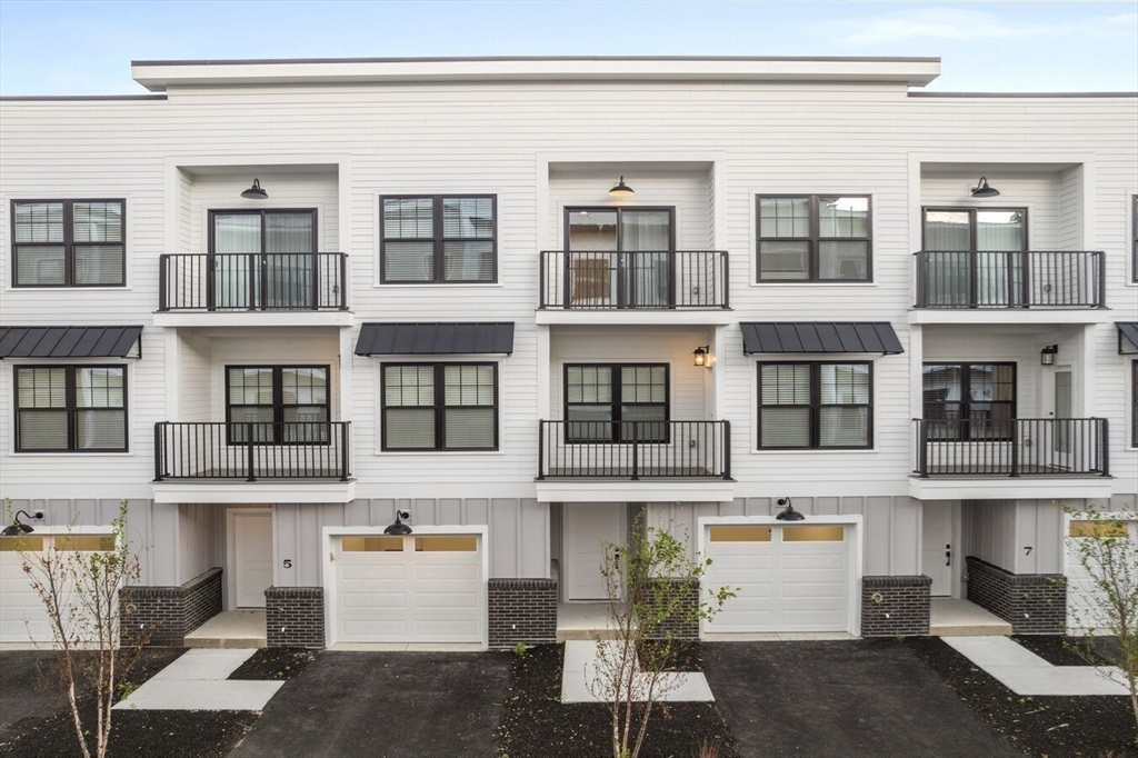 635 Main Street, Unit TH6 Wilmington, MA 01887 - Photo 19 of 29 a view of a building with a lot of windows