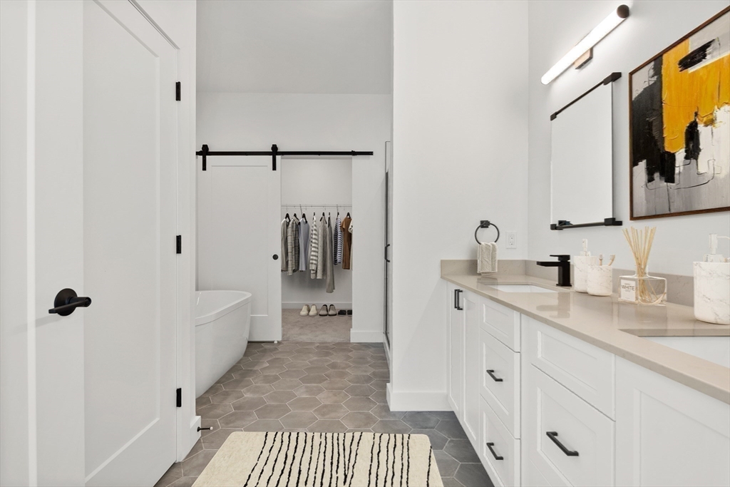 635 Main Street, Unit TH6 Wilmington, MA 01887 - Photo 9 of 29 a bathroom with a sink and a mirror