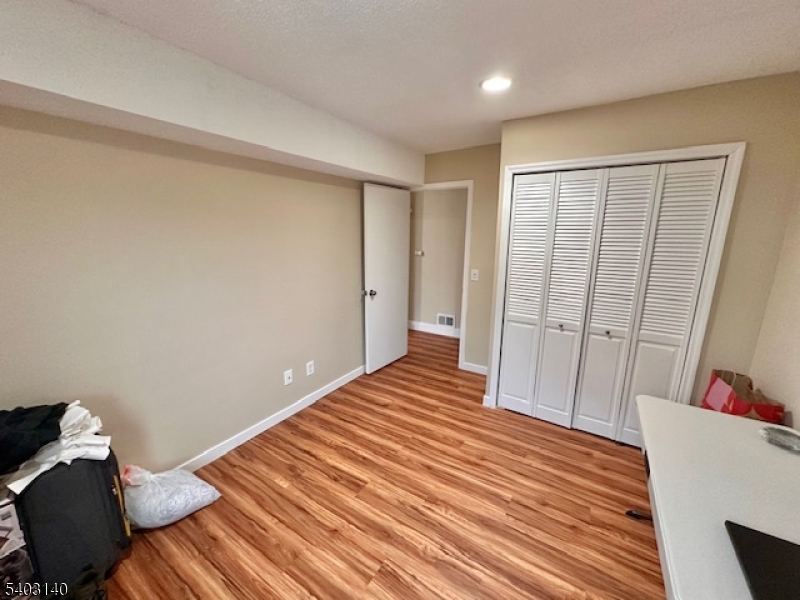 211 Sunshine Court Sayreville, NJ 08859 - Photo 13 of 15 a view of a room with wooden floor and bathroom
