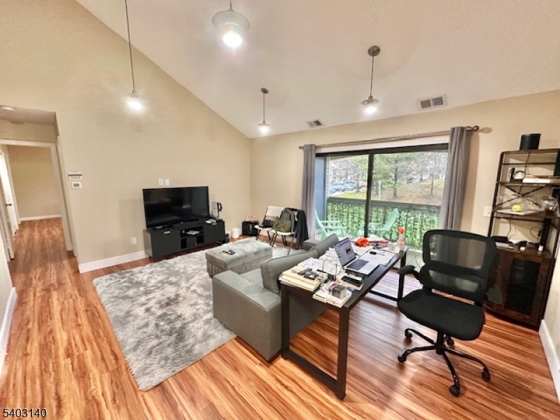 211 Sunshine Court Sayreville, NJ 08859 - Photo 2 of 15 a living room with furniture and a flat screen tv