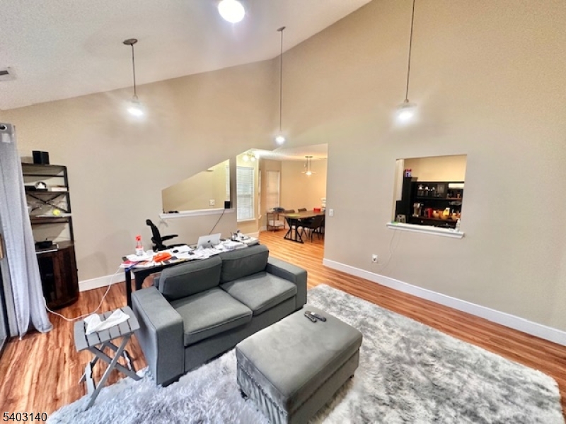 211 Sunshine Court Sayreville, NJ 08859 - Photo 3 of 15 a living room with furniture and a flat screen tv