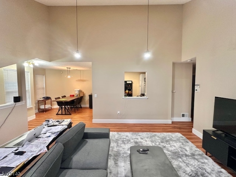 211 Sunshine Court Sayreville, NJ 08859 - Photo 4 of 15 a living room with furniture and a flat screen tv