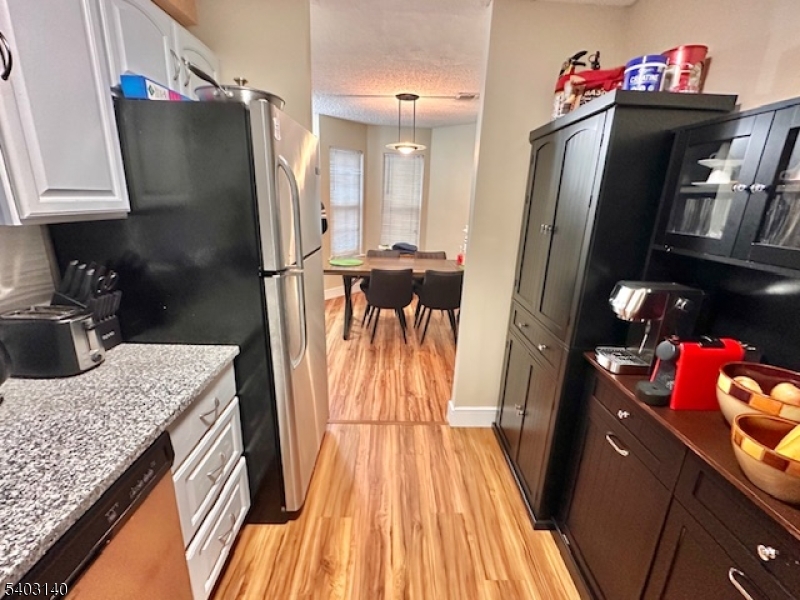 211 Sunshine Court Sayreville, NJ 08859 - Photo 7 of 15 a kitchen with stainless steel appliances granite countertop a refrigerator and a sink