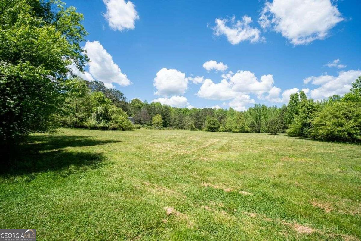 9512 Ephesus Church Road, Unit TRACT 1B) Villa Rica, GA 30180 - Photo 1 of 1 a view of a big yard with large trees