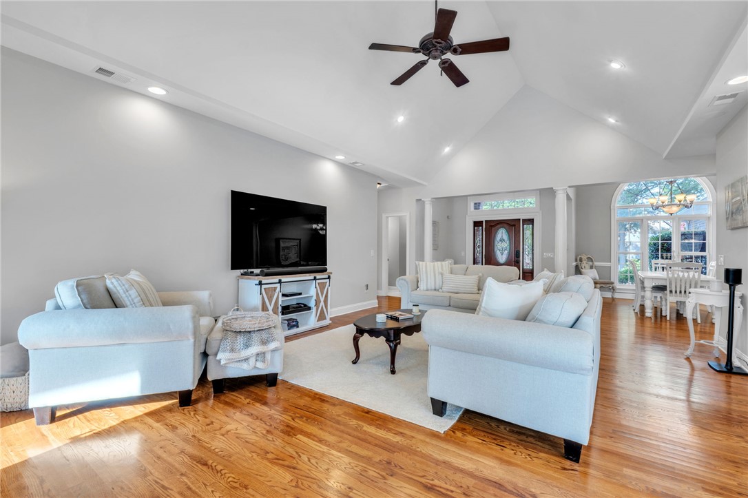 102 Country Walk Lane Clemson, SC 29631 - Photo 5 of 39 A grand entrance with double front doors welcomes you to this spacious living area with warm wood flooring and vaulted ceilings.
