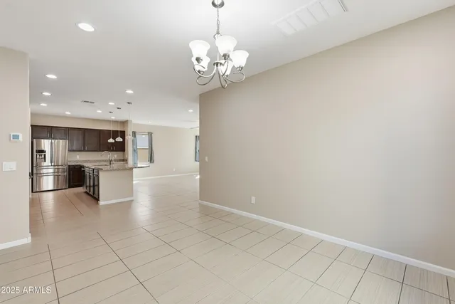 a view of a kitchen with a sink and cabinets