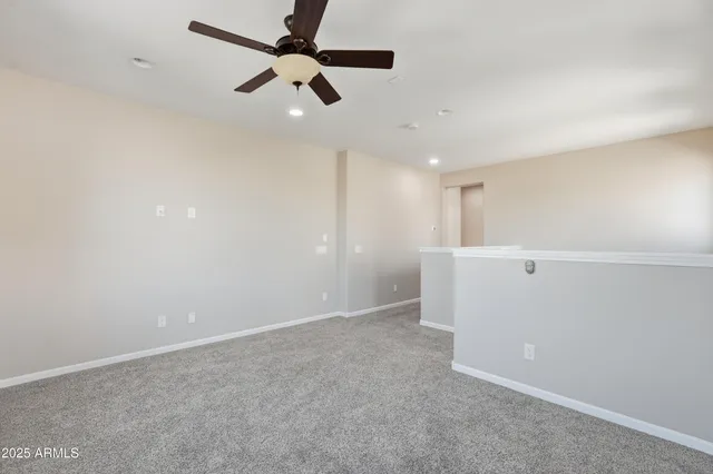 en empty room with ceiling fan