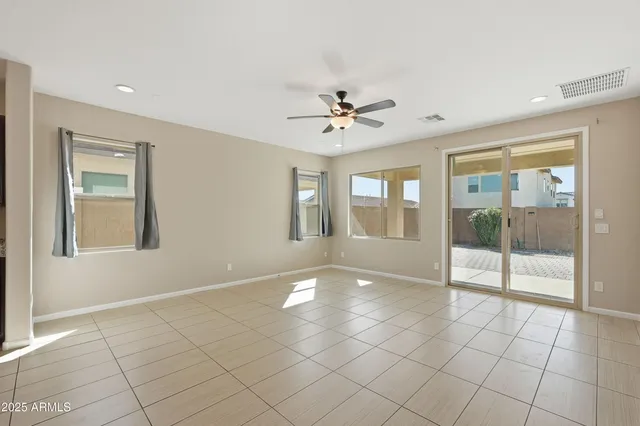 a view of an empty room with glass door