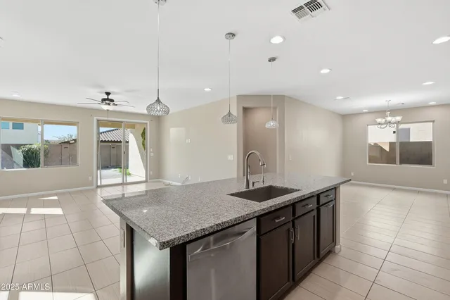 a kitchen with a sink a counter space and appliances