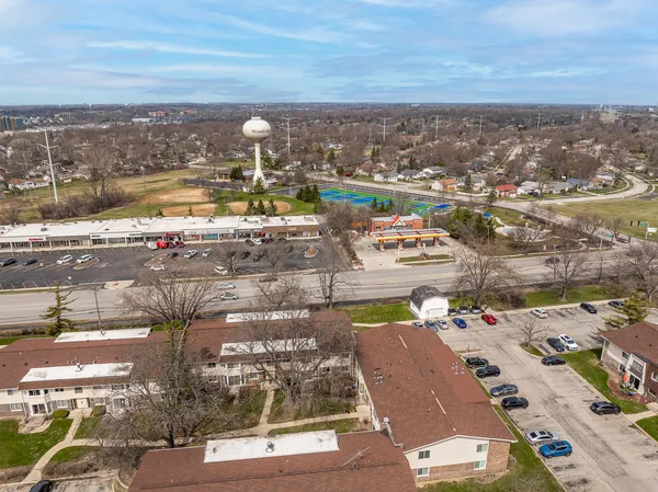 an aerial view of residential houses with outdoor space