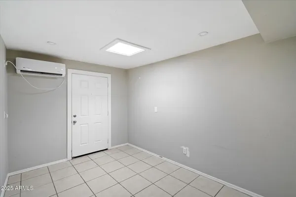 a kitchen with a refrigerator sink and cabinets